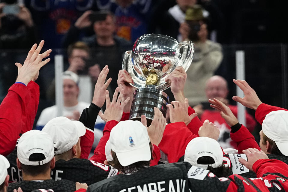 Canada hoists its trophy after defeating Germany to win the Ice Hockey World Championship in Tampere, Finland, Sunday, May 28, 2023. Canada won 5-2. (AP Photo/Pavel Golovkin)