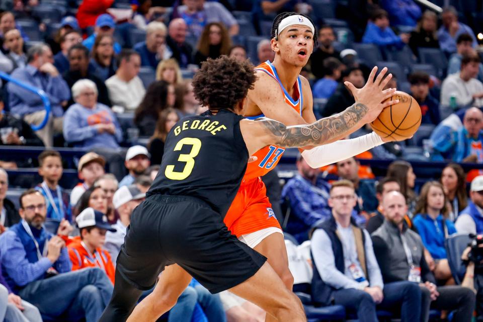 Oklahoma City forward Ousmane Dieng (13) looks to pass past Utah guard Keyonte George (3) in the fourth quarter during an NBA game between the Oklahoma City Thunder and the Utah Jazz at the Paycom Center in Oklahoma City, on Monday, Dec. 11, 2023.