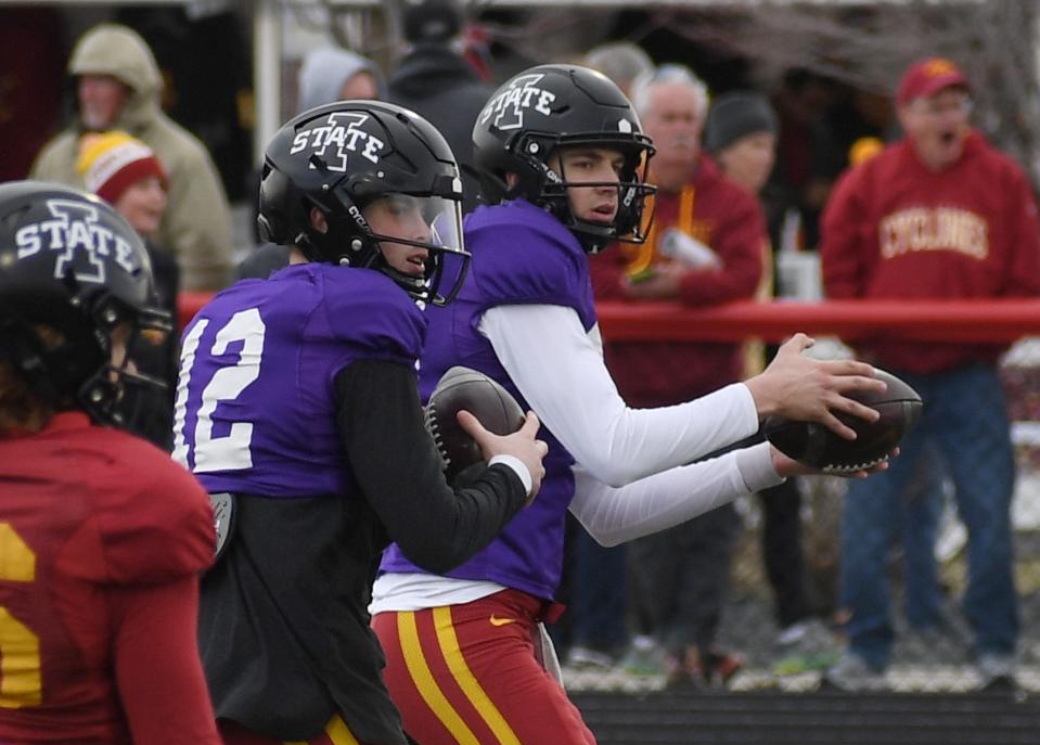 Iowa State quarterbacks Hunter Dekkers, left, and Ashton Cook go through passing drills during a spring practice in April. Dekkers is expected to replace four-year starter Brock Purdy as the Cyclones' quarterback.