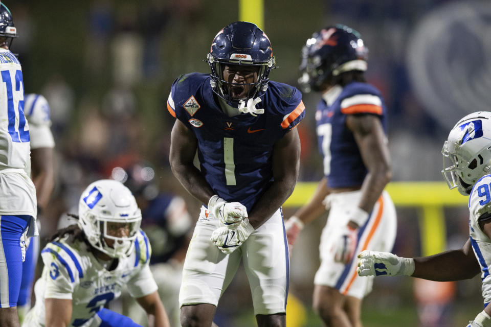 Virginia wide receiver Suderian Harrison (1) celebrates after a big gain against the Duke defense during the second half of an NCAA college football game Saturday, Nov. 18, 2023, in Charlottesville, Va. (AP Photo/Mike Caudill)