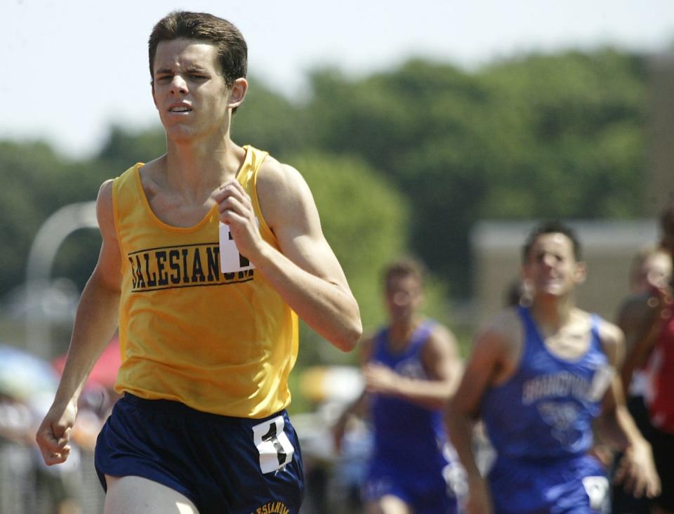 Mike Kowal of Salesianum takes first in the boys 800 meter run Division I Saturday, May 22, 2004.