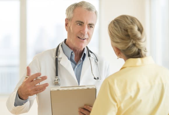 A doctor having a discussion with a female patient.