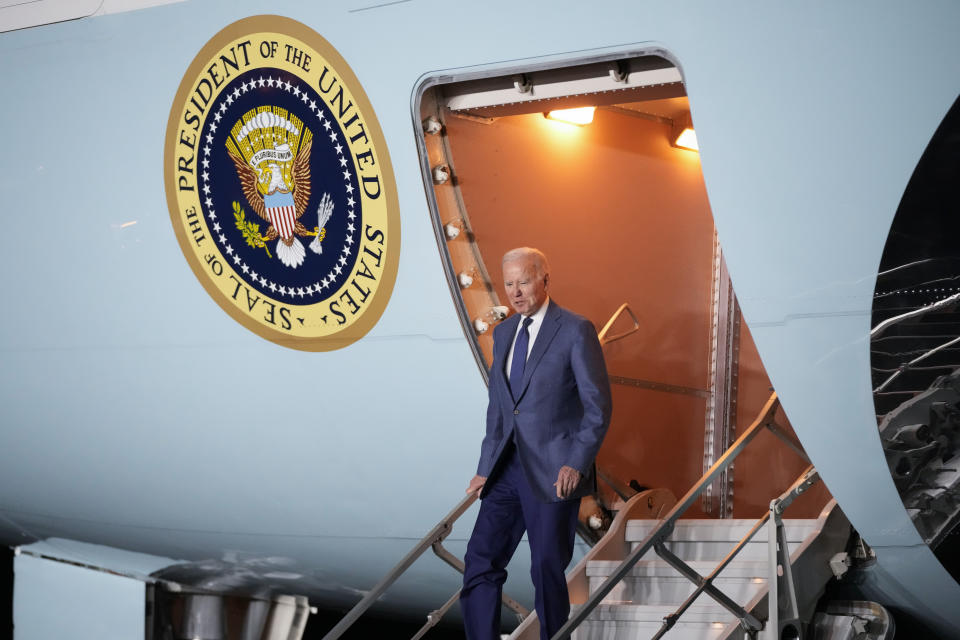 President Joe Biden steps off Air Force One at Belfast International Airport in Belfast, Northern Ireland, Tuesday, April 11, 2023. Biden is visiting the United Kingdom and Ireland in part to help celebrate the 25th anniversary of the Good Friday Agreement. (AP Photo/Patrick Semansky)
