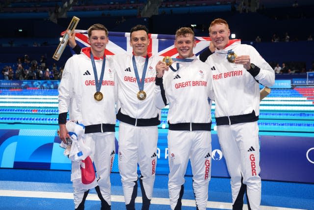 Duncan Scott, James Guy, Matt Richards and Tom Dean celebrate with their Olympic gold medals