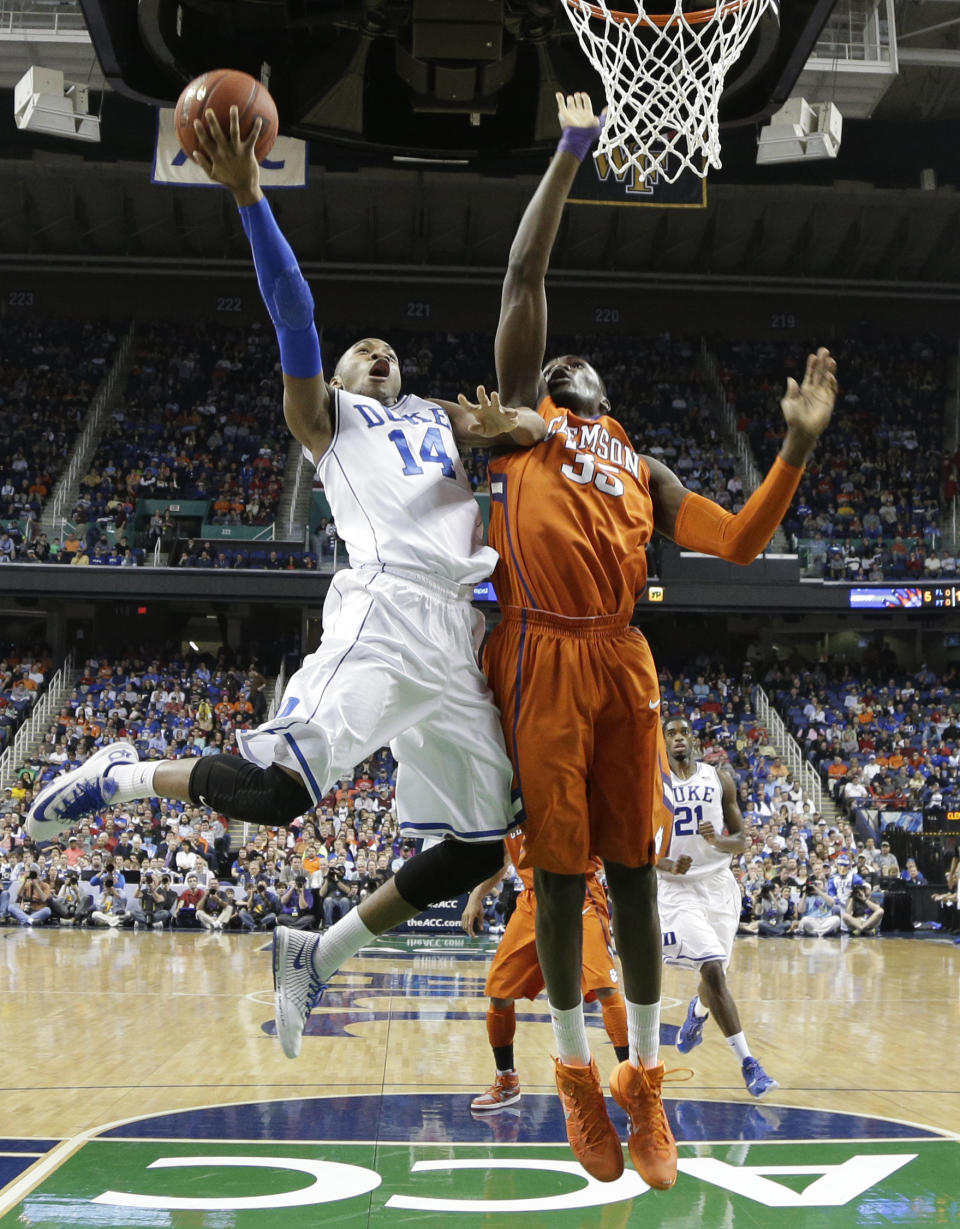 Duke's Rasheed Sulaimon (14) shoots as Clemson's Landry Nnoko (35) defends during the first half of a quarterfinal NCAA college basketball game at the Atlantic Coast Conference tournament in Greensboro, N.C., Friday, March 14, 2014. (AP Photo/Gerry Broome)