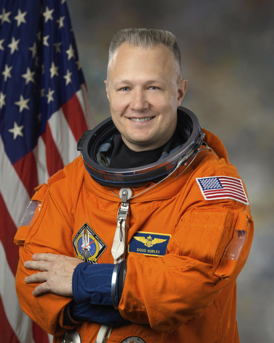 This Feb. 11, 2011 photo provided by NASA shows astronaut Douglas Hurley in a Launch Entry Suit used in space shuttle missions. (Bill Stafford/NASA via AP)