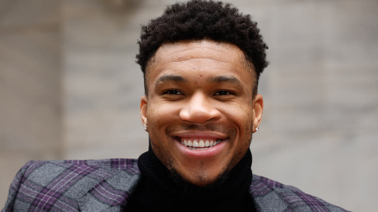 Giannis Antetokounmpo wearing turtleneck and blazer