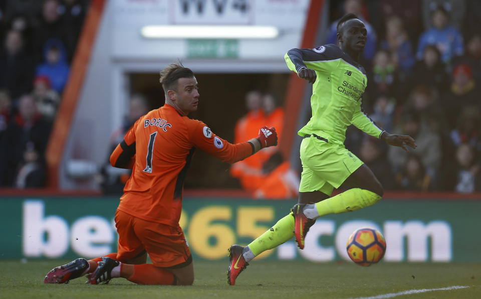 Britain Football Soccer - AFC Bournemouth v Liverpool - Premier League - Vitality Stadium - 4/12/16 Liverpool's Sadio Mane scores their first goal as Bournemouth's Artur Boruc looks on Action Images via Reuters / Paul Childs Livepic EDITORIAL USE ONLY. No use with unauthorized audio, video, data, fixture lists, club/league logos or "live" services. Online in-match use limited to 45 images, no video emulation. No use in betting, games or single club/league/player publications. Please contact your account representative for further details.