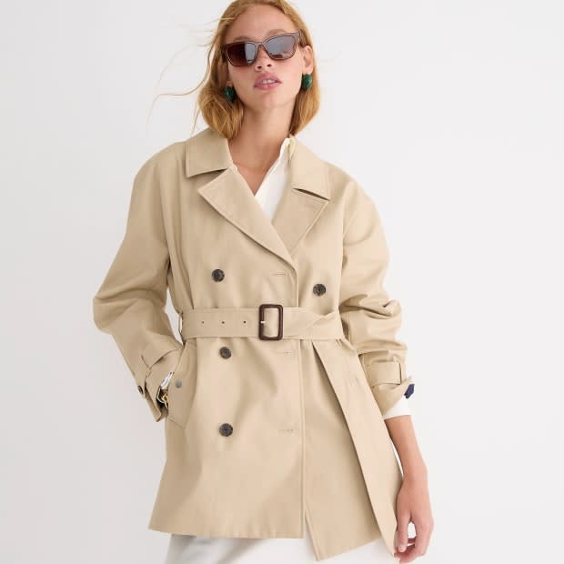 <p>J. Crew Short Trench Coat, $248, <a href="https://rstyle.me/+f9bUF91A2NrvXEcaNnITZg" rel="nofollow noopener" target="_blank" data-ylk="slk:available here;elm:context_link;itc:0;sec:content-canvas" class="link ">available here</a> (sizes S-XXL)</p>