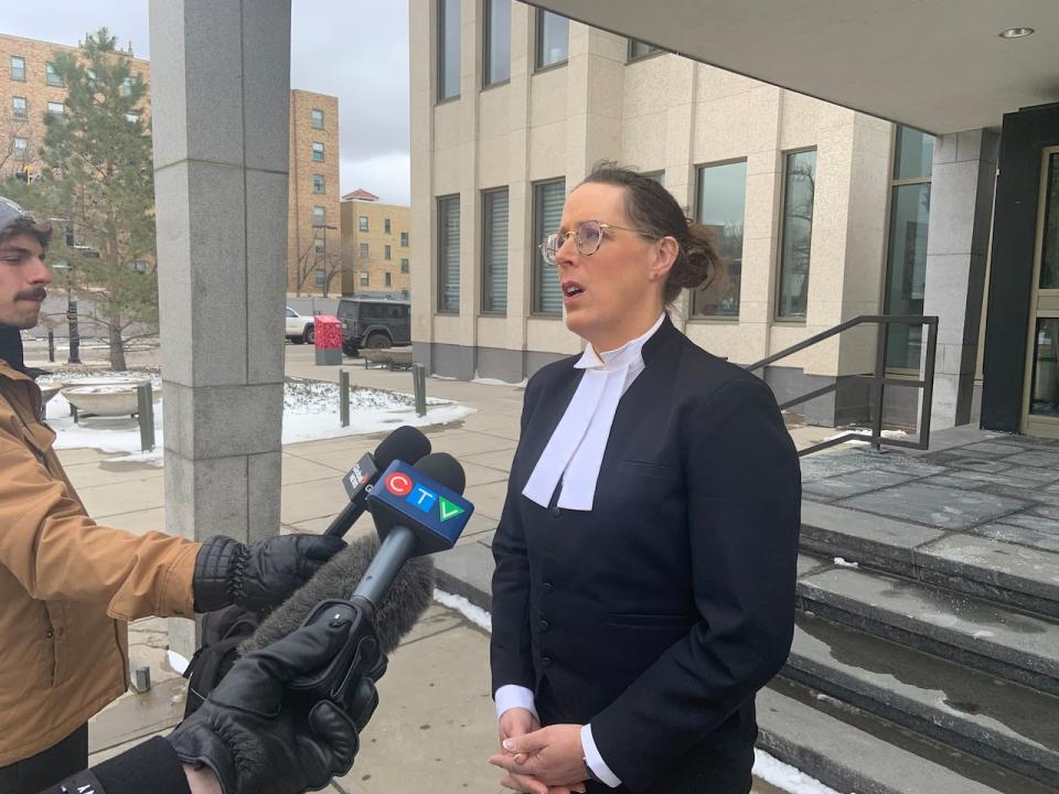 Crown Prosecutor Zoey Kim-Zeggelaar speaks to reporters outside Regina Court of King's Bench Friday afternoon. She says the guilty verdict brings closure to Michael Gordon Jackson's daughter and her mother.