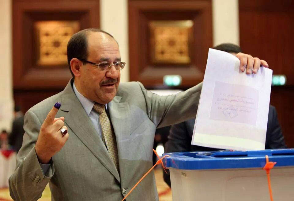 Iraqi Prime Minister Nouri al-Maliki prepares to casts his vote at a polling station in the heavily fortified Green Zone in Baghdad, Iraq, Wednesday, April 30, 2014. Iraqis braved the threat of bombs and other violence to vote Wednesday in parliamentary elections amid a massive security operation as the country slides deeper into sectarian strife. (AP Photo)