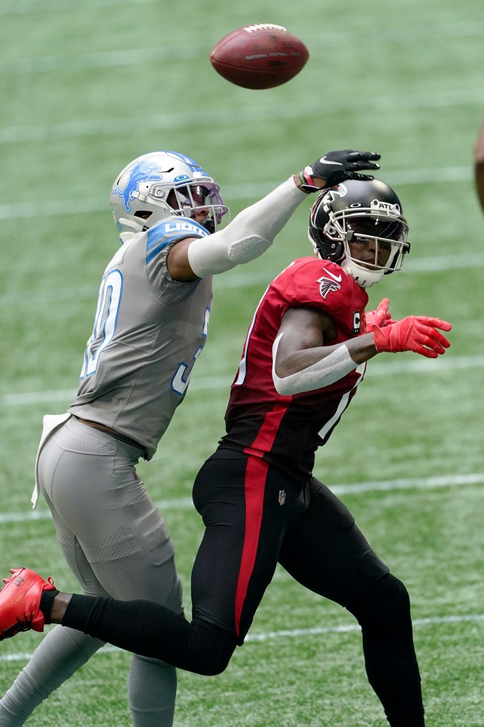 Lions cornerback Jeff Okudah breaks up a pass intended for Falcons receiver Julio Jones during the first half on Sunday, Oct. 25, 2020, in Atlanta.