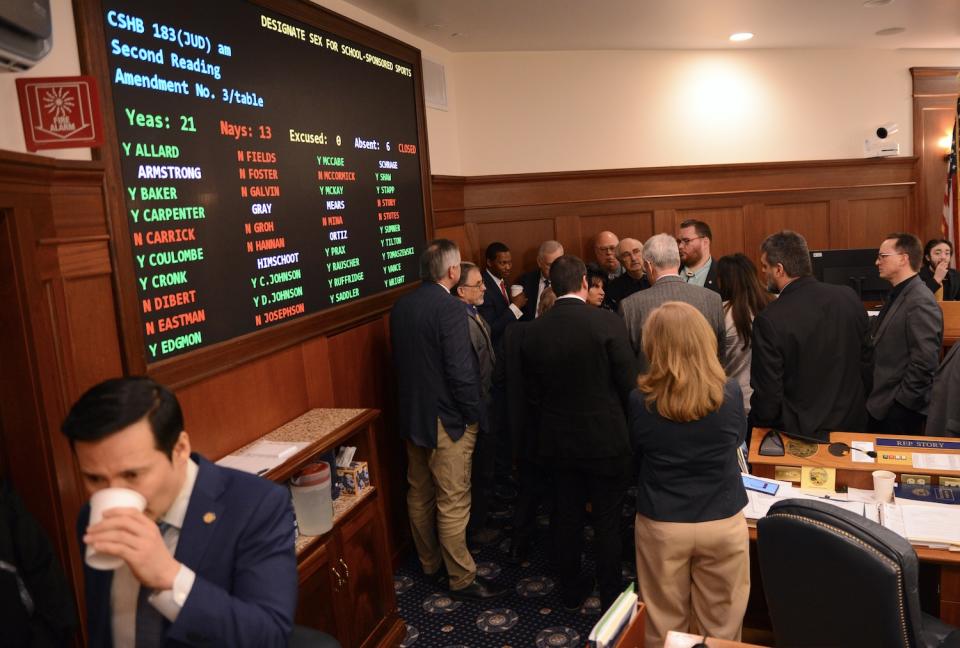 Members of the Alaska House's majority caucus gather in a corner of the House chambers Saturday, May 11, 2024, to discuss potential rules for debate on House Bill 183. (Photo by James Brooks/Alaska Beacon)