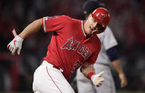 Los Angeles Angels center fielder Mike Trout rounds first after hitting a two-run home run during the eighth inning of a baseball game against the Seattle Mariners on Friday, April 19, 2019, in Anaheim, Calif. (AP Photo/Mark J. Terrill)