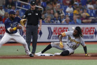 Pittsburgh Pirates shortstop Oneil Cruz slides into third, beating the throw to Tampa Bay Rays third baseman Yandy Diaz during the fourth inning of a baseball game Friday, June 24, 2022, in St. Petersburg, Fla. (AP Photo/Scott Audette)