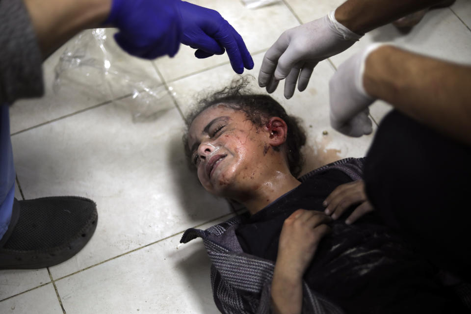 A Palestinian child wounded during the Israeli bombardment of the Gaza Strip receives treatment at the Nasser hospital in Khan Younis, Southern Gaza Strip, Saturday, Jan. 6, 2024. (AP Photo/Mohammed Dahman)