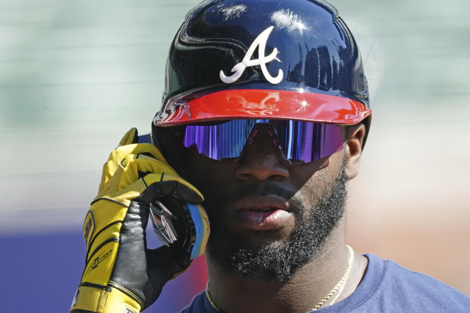 Atlanta Braves outfielder Michael Harris II adjusts his helmet as he takes batting practice ahead of Game 1 of baseball's National League Division Series, Monday, Oct. 10, 2022, in Atlanta. (AP Photo/John Bazemore)