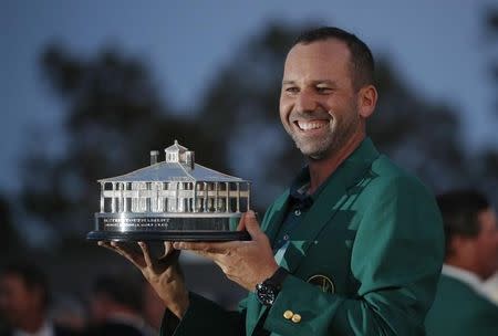 Sergio Garcia of Spain holds the Masters trophy after winning the 2017 Masters golf tournament at Augusta National Golf Club in Augusta, Georgia, U.S., April 9, 2017. REUTERS/Brian Snyder