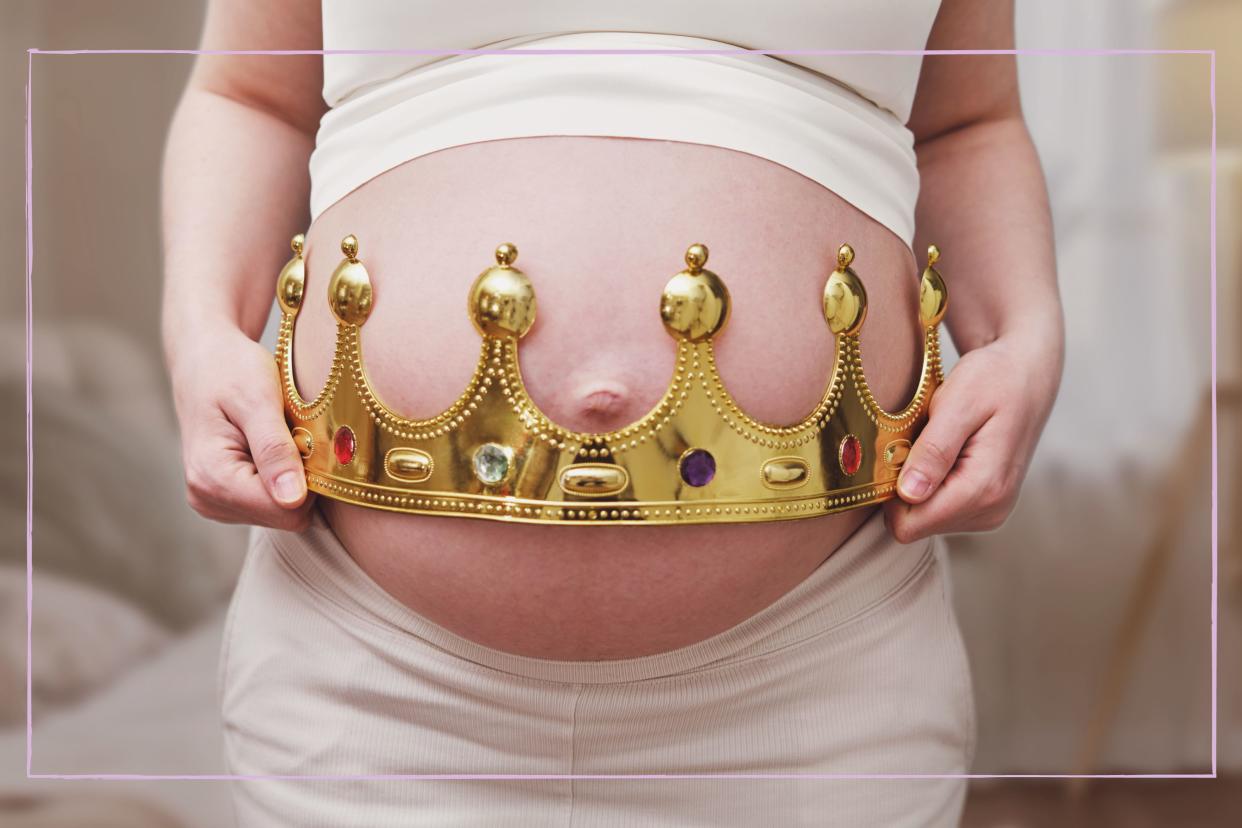  Baby bump with crown around it. 