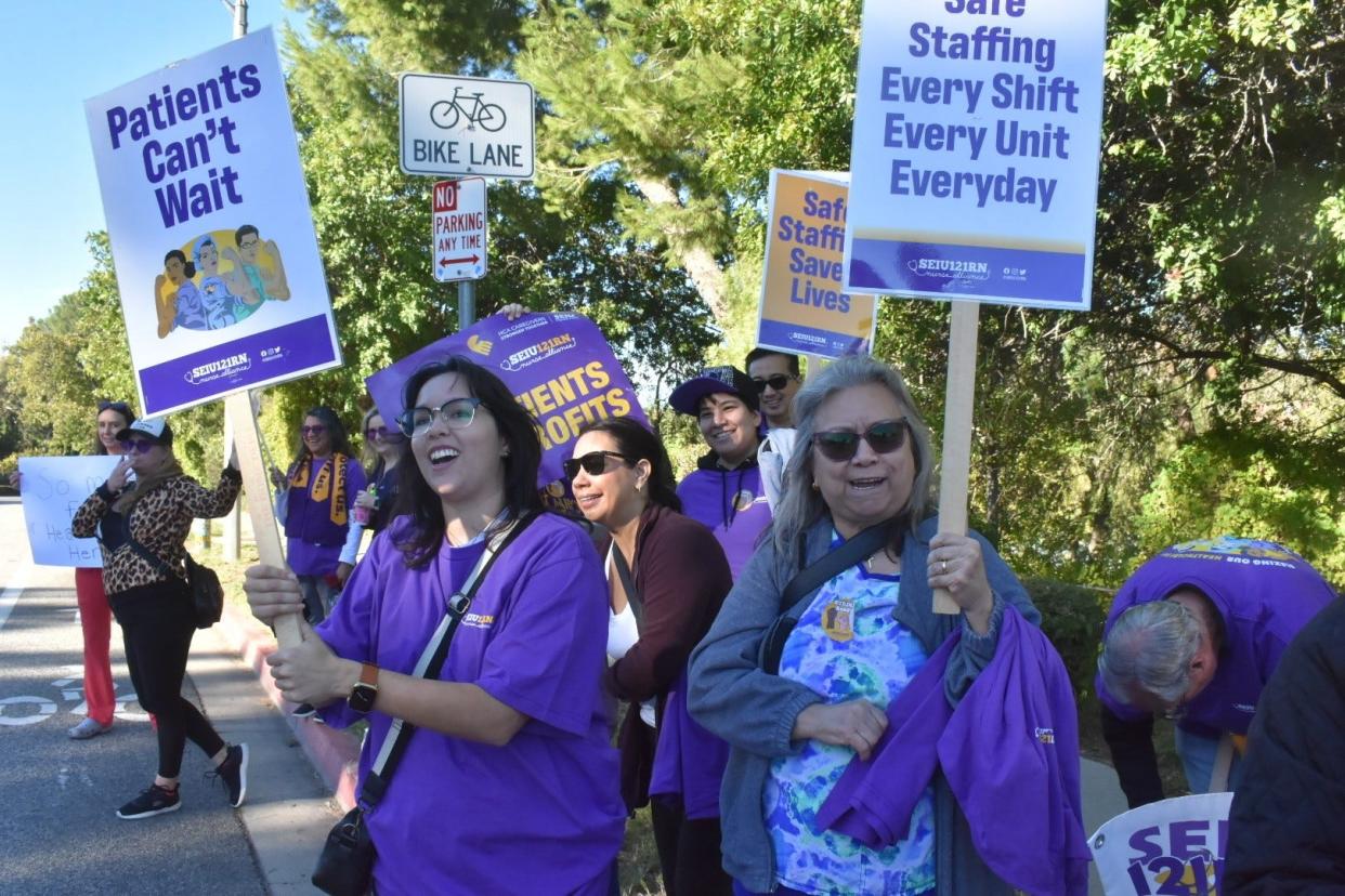 Rita Nobile supports her mother, nurse Delma Nobile, at right, during a five-day strike at Los Robles Regional Medical Center in November. Nurses ratified a three-year contract this week.