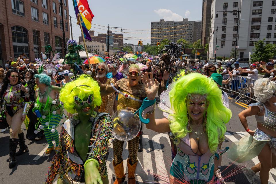 Bambi the Mermaid, Queen of Coney Island, right, marches in the annual Coney Island Mermaid Parade on June 22, 2024 in New York City.