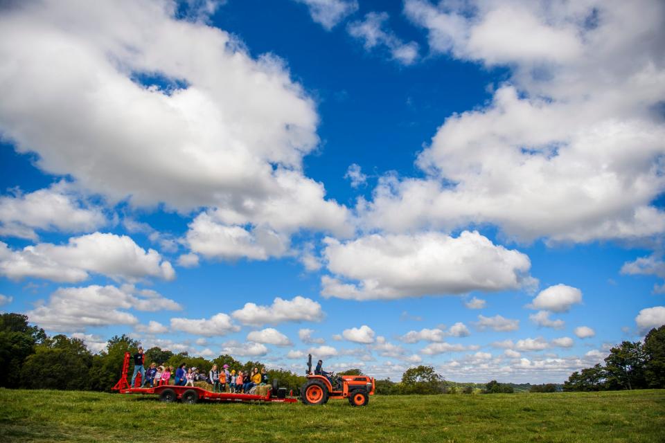 Kids enjoy a hay ride during 	Children's Farm Festival at Peden Farm on Thursday, Sept. 29, 2022. 