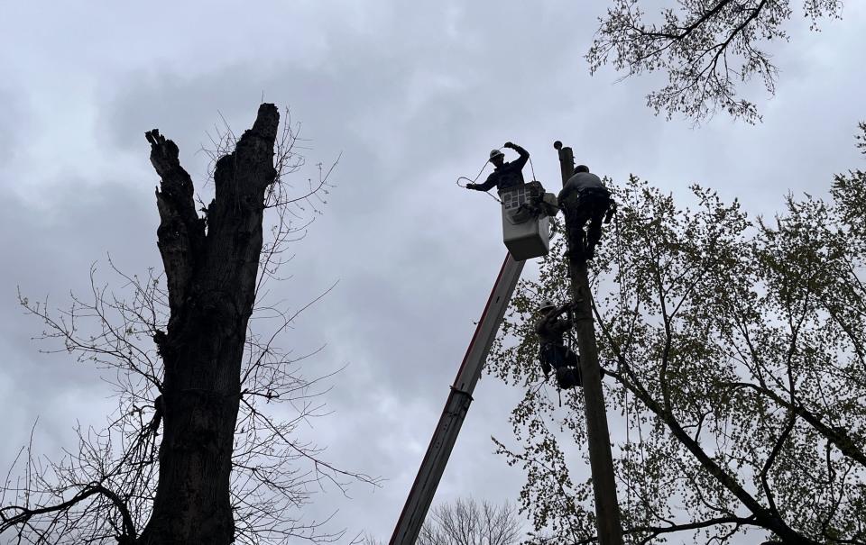 CenterPoint Energy linemen work to repair a broken power pole in Newburgh on Thursday, April 4, 2024, after severe weather tore through the Tri-State Area on Tuesday.