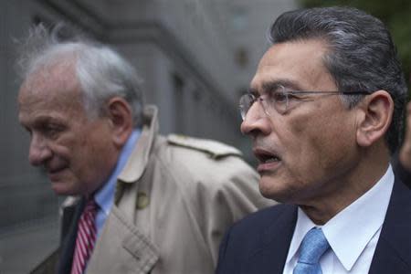 Former Goldman Sachs Group Inc board member Rajat Gupta leaves the U.S. District Court with his lawyer Gary Naftalis after he was sentenced in Manhattan, New York October 24, 2012. REUTERS/Adrees Latif