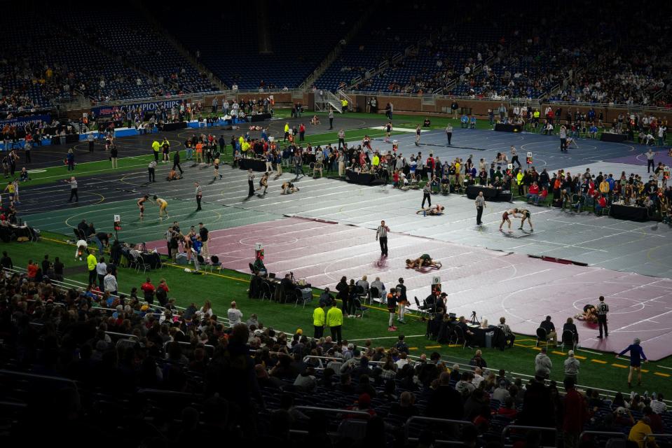 Thousands watch the first day of high school wrestling individual state finals at Ford Field in Detroit on Friday, March 3, 2023.