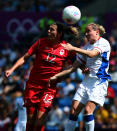 COVENTRY, ENGLAND - AUGUST 09: Christine Sinclair of Canada battles with Sandrine Soubeyrand of France during the Women's Football Bronze Medal match between Canada and France, on Day 13 of the London 2012 Olympic Games at City of Coventry Stadium on August 9, 2012 in Coventry, England. (Photo by Stanley Chou/Getty Images)