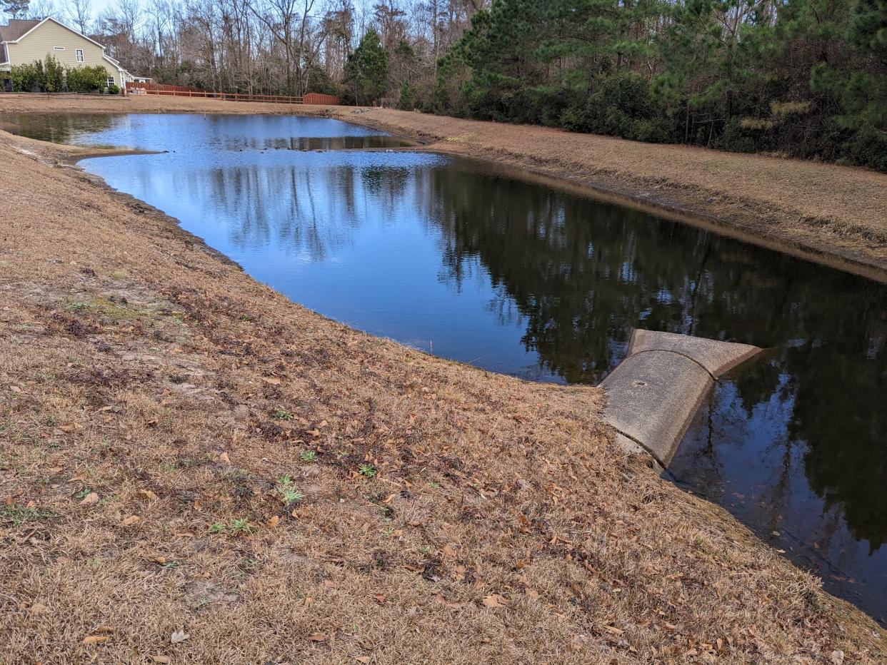 A retention pond in Ogden, outside of Wilmington, looking fuller than it has in months after last weekend's heavy rains. Despite the recent downpours, the region remains mired in drought.