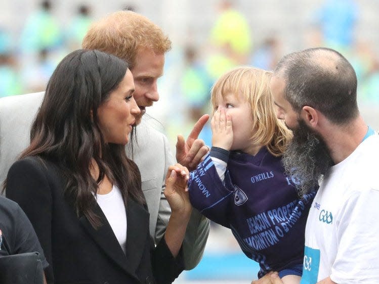Prince Harry scolds a young girl who pulled Meghan Markle's hair