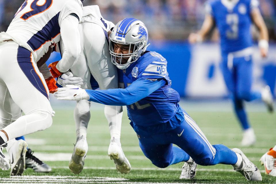 Detroit Lions linebacker Jalen Reeves-Maybin (42) tackles Denver Broncos kick return Marvin Mims Jr. (19) during the first half at Ford Field in Detroit on Saturday, Dec. 16, 2023.