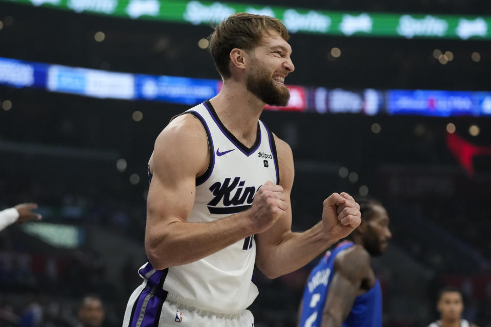 Sacramento Kings forward Domantas Sabonis (10) reacts after losing possession of the ball during the first half of an NBA basketball game against the Los Angeles Clippers in Los Angeles, Tuesday, Dec. 12, 2023. (AP Photo/Ashley Landis)