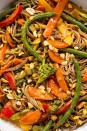 <p>We're going (pea)NUTS for this Thai-inspired sauce.</p><p>Get the <a href="https://www.delish.com/uk/cooking/recipes/a28756736/rainbow-stir-fry-recipe/" rel="nofollow noopener" target="_blank" data-ylk="slk:Rainbow Stir Fry;elm:context_link;itc:0" class="link ">Rainbow Stir Fry</a> recipe.</p>