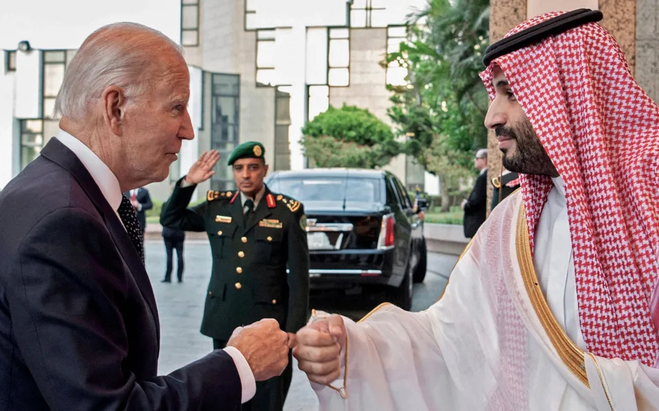 (FILES) In this file handout photo released by the Saudi Royal Palace on July 15, 2022 shows Saudi Crown Prince Mohammed bin Salman (R) bumps fists with US President Joe Biden at Al-Salam Palace in the Red Sea port of Jeddah. - Riyadh, Moscow and other top oil producers agreed last week to a deep cut in production to boost crude prices, in a move denounced by the United States as a concession to Moscow that would hurt the global economy. (Photo by Bandar AL-JALOUD / Saudi Royal Palace / AFP) / RESTRICTED TO EDITORIAL USE - MANDATORY CREDIT "AFP PHOTO / MEDIA OFFICE OF MOHAMMED BIN SALMAN /BANDAR ALGALOUD" - NO MARKETING NO ADVERTISING CAMPAIGNS - DISTRIBUTED AS A SERVICE TO CLIENTS (Photo by BANDAR AL-JALOUD/Saudi Royal Palace/AFP via Getty Images) - BANDAR AL-JALOUD/AFP via Getty Images