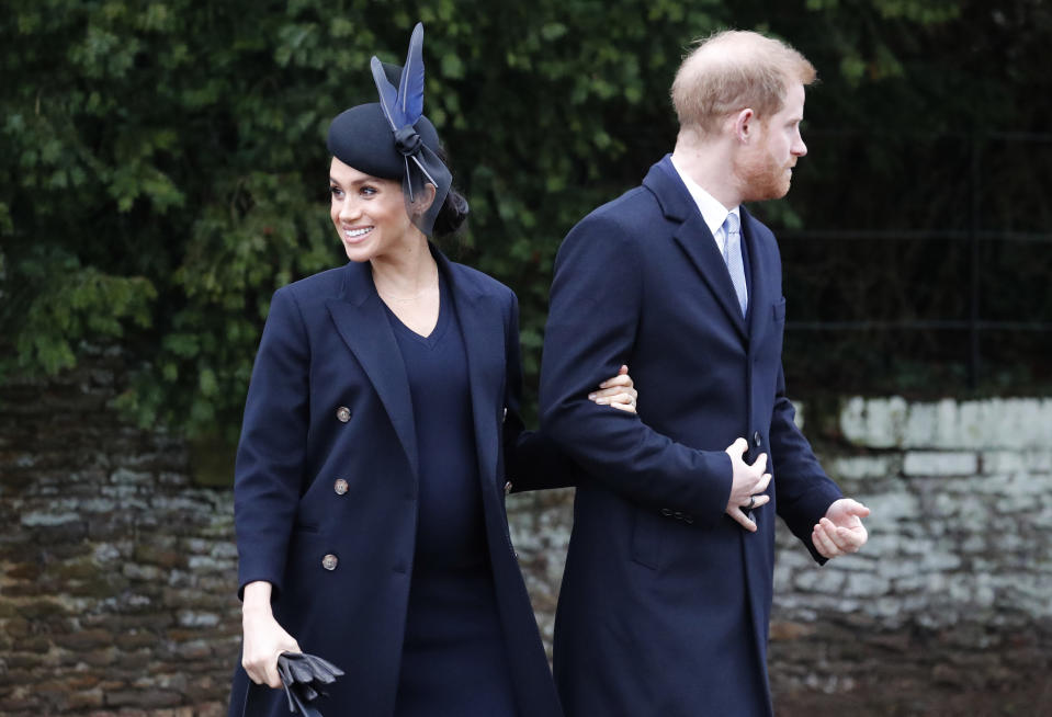 Britain's Prince Harry and Meghan, Duchess of Sussex leave after attending the Christmas day service at St Mary Magdalene Church in Sandringham in Norfolk, England, Tuesday, Dec. 25, 2018. (AP Photo/Frank Augstein)