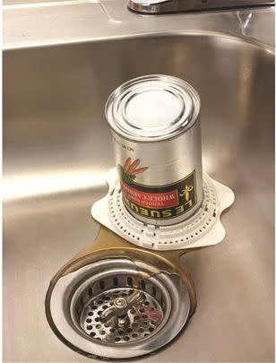 Easily drain your tins with this snap-on tin strainer