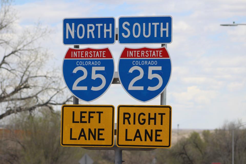 Signs direct commuters to Interstate 25 in Pueblo.