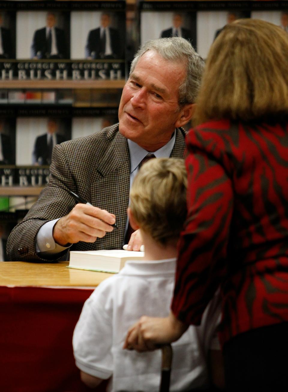 George W. Bush Signs Copies Of His New Memoir "Decision Points"