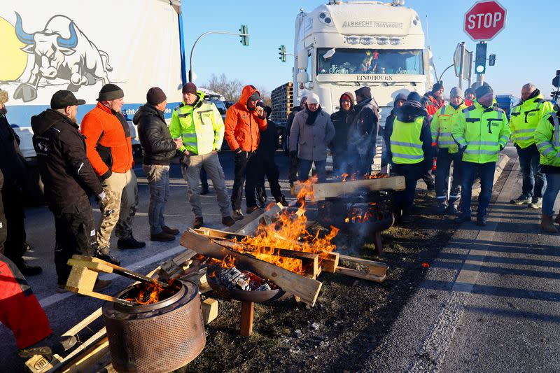 German farmers take part in a protest against the cut of vehicle tax subsidies