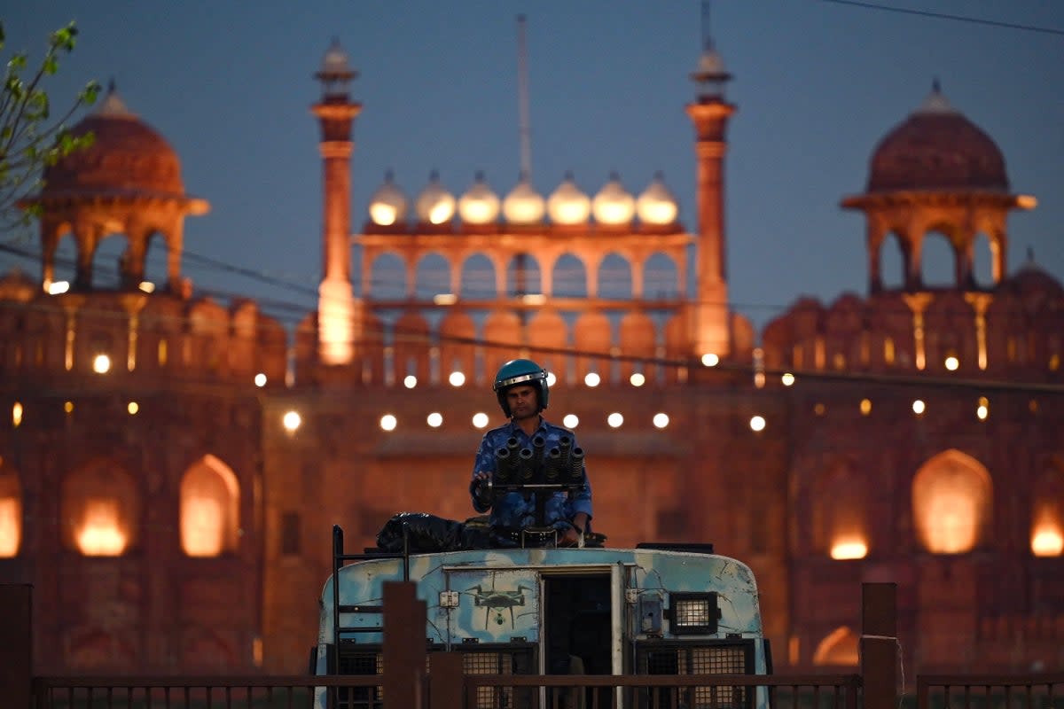 A soldier stands guard outside the Red Fort during protests over Rahul Gandhi’s criminal defamation case (AFP/Getty)