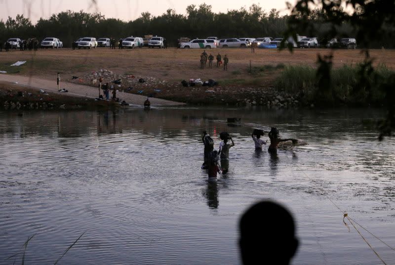 Migrants seeking refuge in the U.S. cross Rio Grande river in Ciudad Acuna