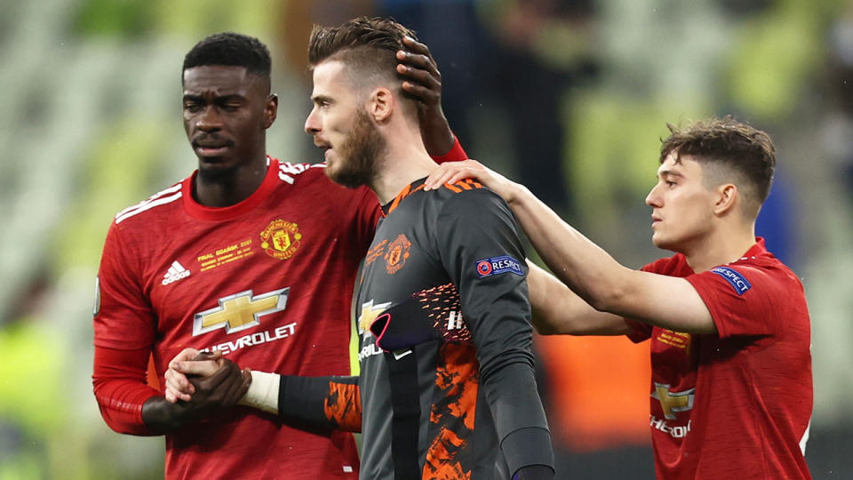 Manchester United teammates are pictured here comforting David de Gea after the Europa League final.