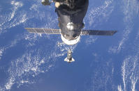 The space shuttle Discovery is seen with Earth in the background as the shuttle approaches the International Space Station for docking in this February 26, 2011 photograph by an Expedition 26 crew member released by NASA. Shuttle Discovery astronauts worked alongside the International Space Station crew on Sunday to prepare the orbital outpost for life after the United States retires its three existing spaceships. Picture taken February 26, 2011. REUTERS/NASA