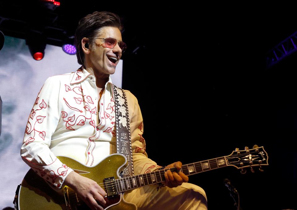 John Stamos has great respect for Beach Boy and touring partner Mike Love. "He's 83. And he buries all of us onstage every night.. I'm not kidding."