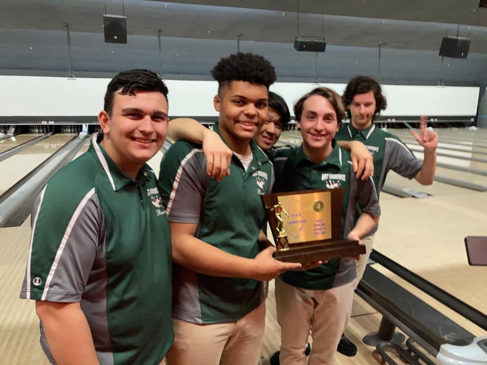 East Brunswick bowlers pose with the trophy after winning Group 4 at the NJSIAA boys team finals on Monday, Feb. 20, 2023 at Bowlero North Brunswick.