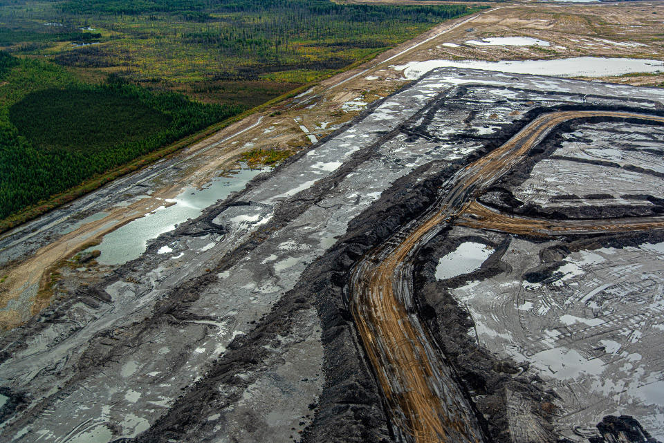 An oil sands mine in Alberta, Canada adjascent to boreal forest outside of Fort McMurray. (Michael Kodas)