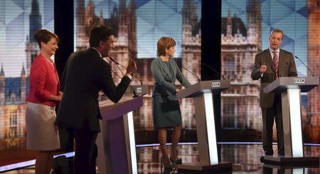 Britain's opposition Labour Party leader Ed Miliband, (back L-R) Plaid Cymru leader Leanne Wood, Green Party leader Natalie Bennett (obscured), SNP leader Nicola Sturgeon and Nigel Farage the leader of UKIP participate in the televised leaders' debate in London, April 16, 2015. REUTERS/Stefan Rousseau/Pool