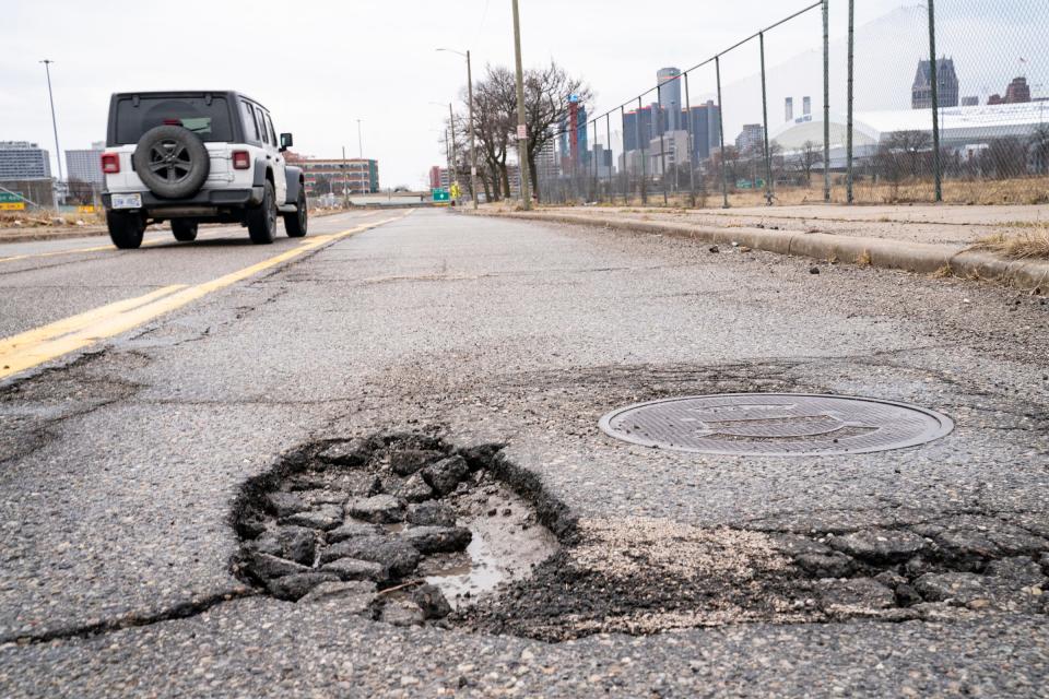 A pothole on the Chrysler service drive in Detroit on Wednesday, March 30, 2022.